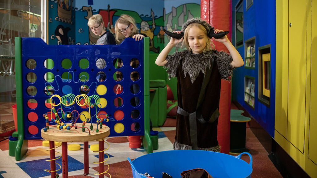 Children playing in the Vikling's Den on board