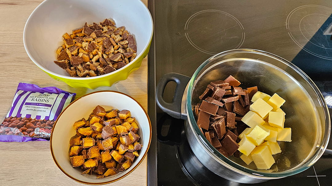 Chop up the digestives, crunchies, chocolate and butter into small pieces