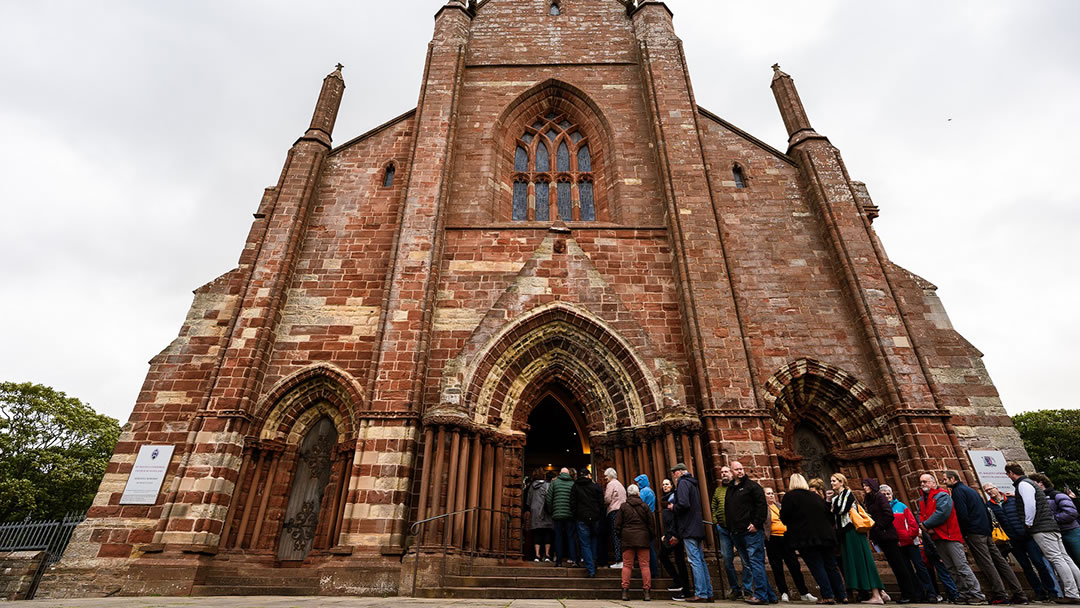 Concert-goers queue outside St Magnus Cathedral for the NorthLink FARA concert