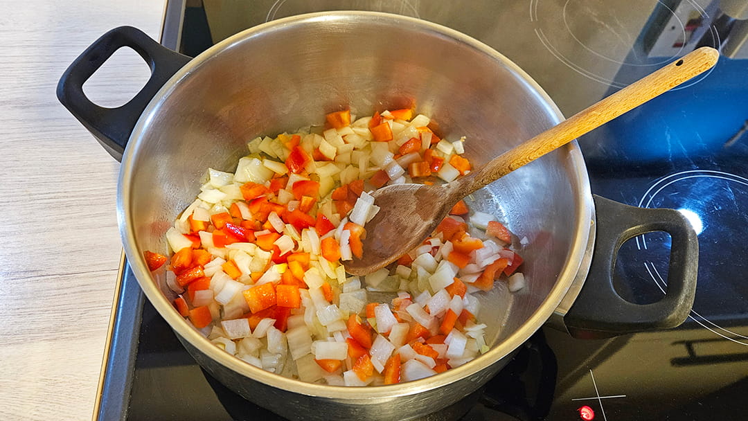 Cooking the diced onion and pepper