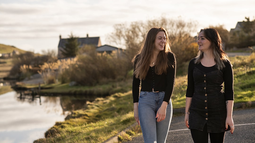 Friends walking together in Shetland