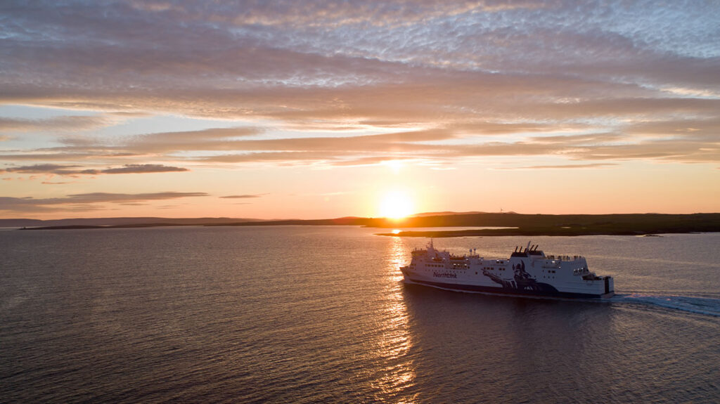 MV Hjaltland sailing to Orkney as the sun sets