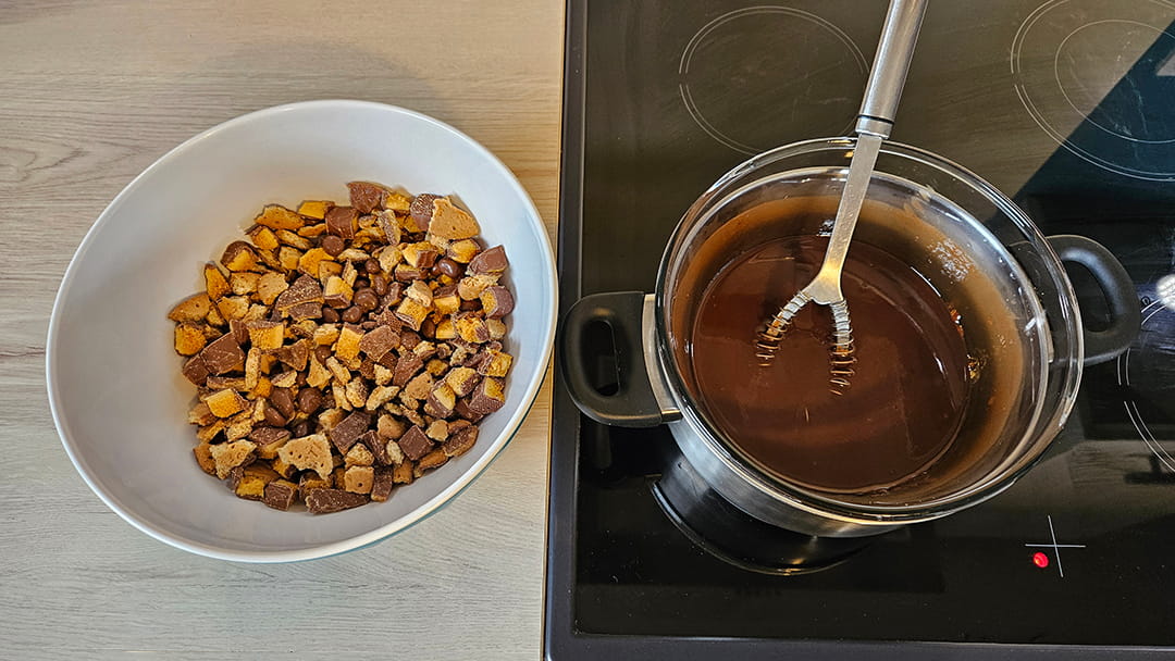 Melt the chocolate and butter together and stir in to the biscuits, crunchies and raisins