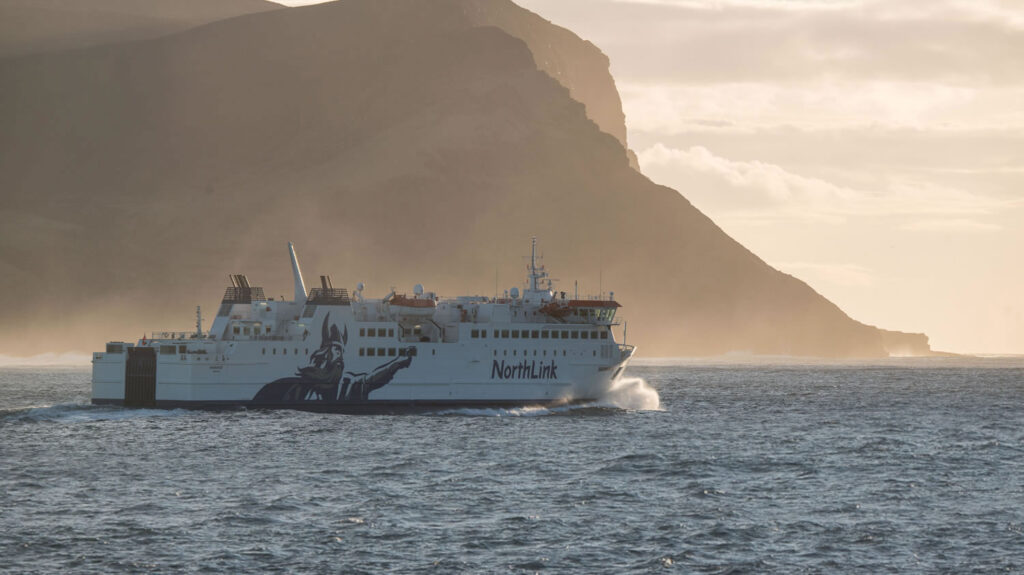 MV Hamnavoe sailing from Orkney under the Kame of Hoy