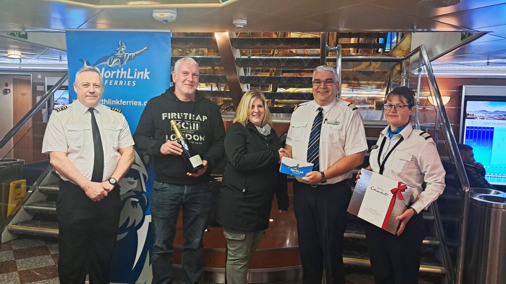 Donna Fraser, the 400,000th passenger of NorthLink Ferries in 2024, is pictured with Brian Pottinger, Captain, Seumas Campbell, Hotel Director, and Jaquie Sinclair, Purser onboard the MV Hrossey
