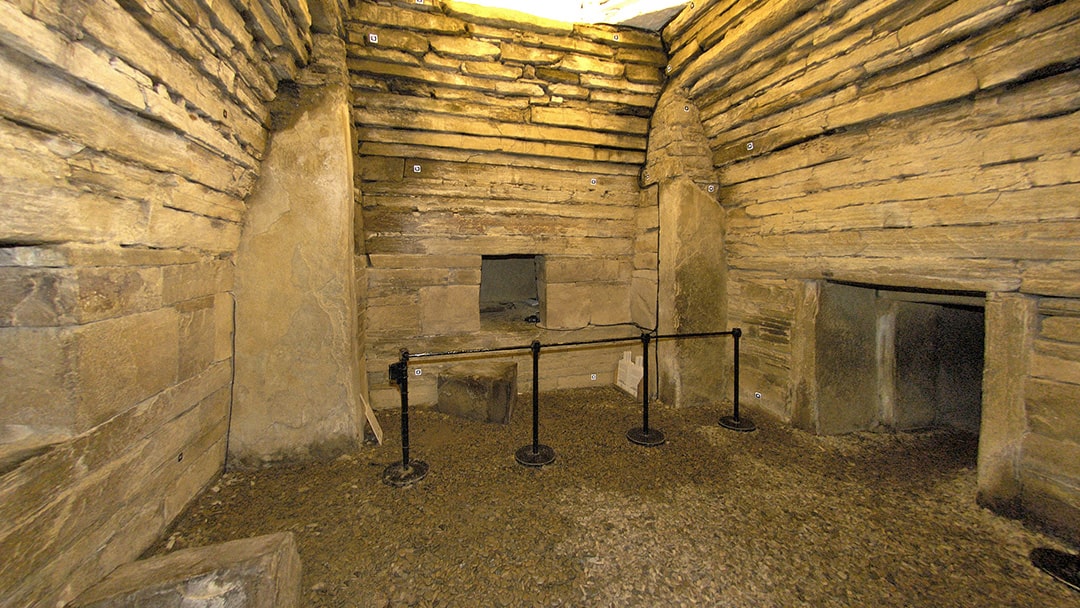 Standing stones are embedded in each corner of Maeshowe's main chamber