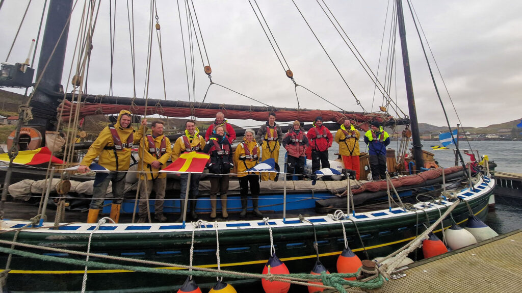 Swan returns home with new mast