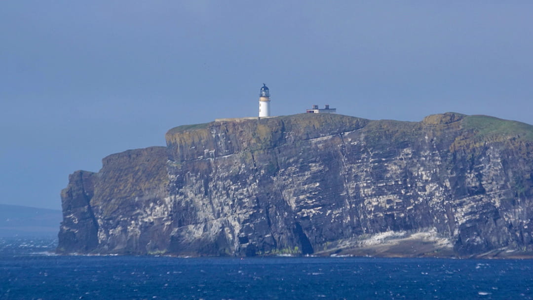 The tall, rugged cliffs beneath Copinsay Lighthouse